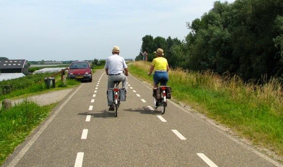 An older couple riding the bike paths of Holland