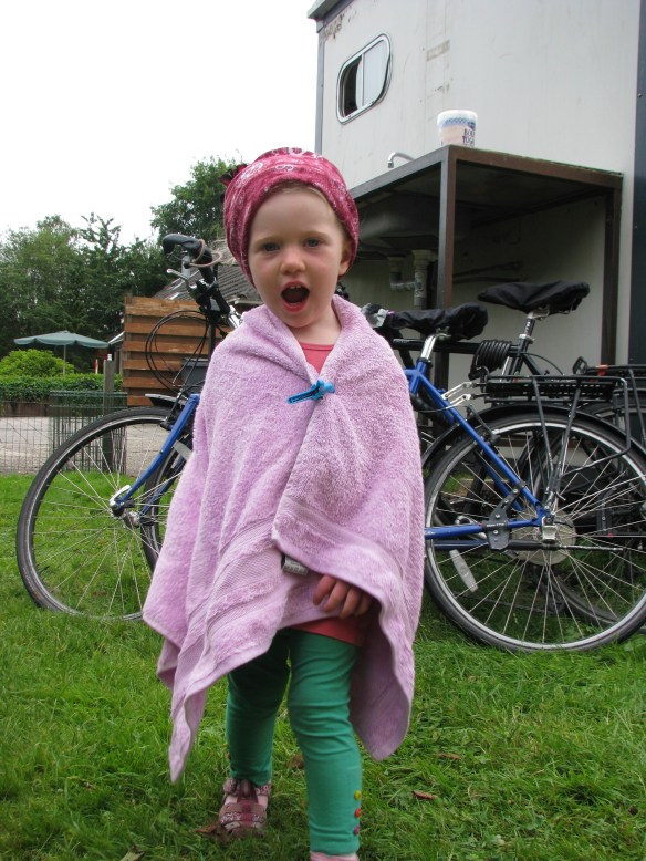 Dressing up with her "Hello Kitty" cape.... don't ask me, it wasn't my idea!